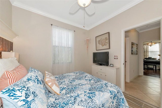 bedroom featuring ceiling fan, tile patterned floors, and ornamental molding