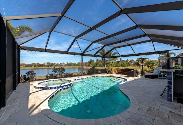 view of pool with outdoor lounge area, an in ground hot tub, glass enclosure, a water view, and a patio area