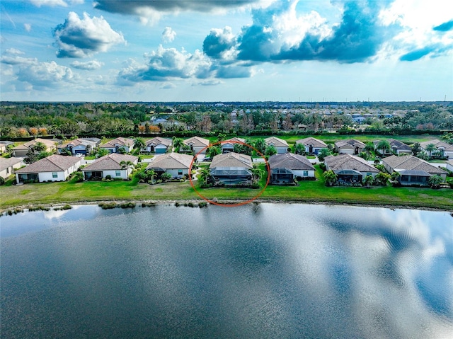 birds eye view of property with a water view