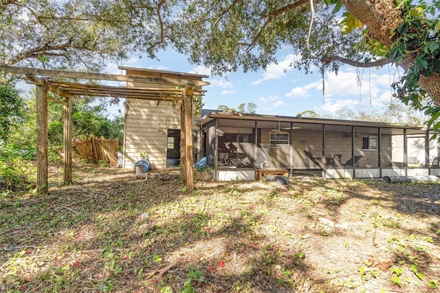 view of outbuilding with a sunroom