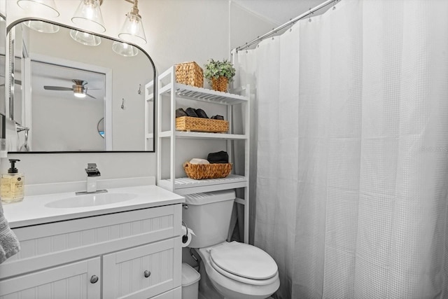 bathroom featuring vanity, ceiling fan, and toilet