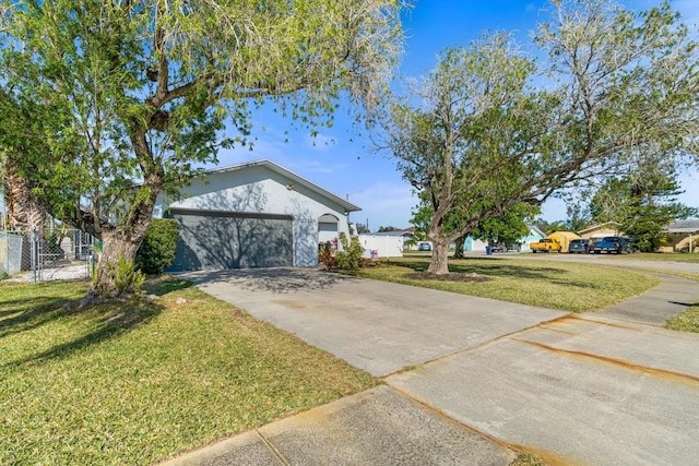 view of front facade with a garage and a front yard