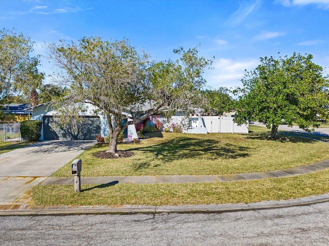 view of front facade featuring a garage and a front yard