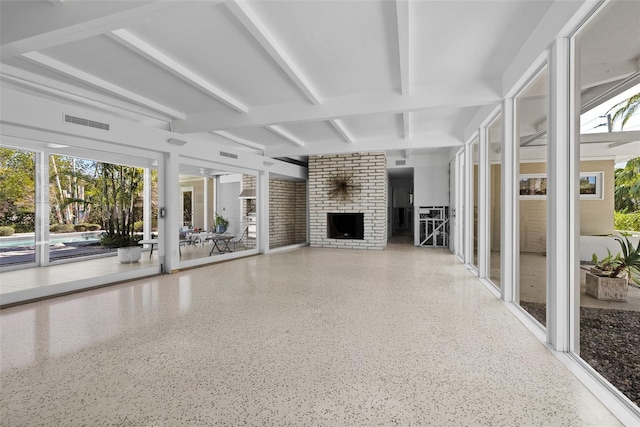 unfurnished living room with a brick fireplace