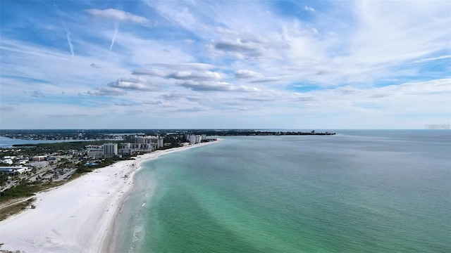 bird's eye view featuring a view of the beach and a water view