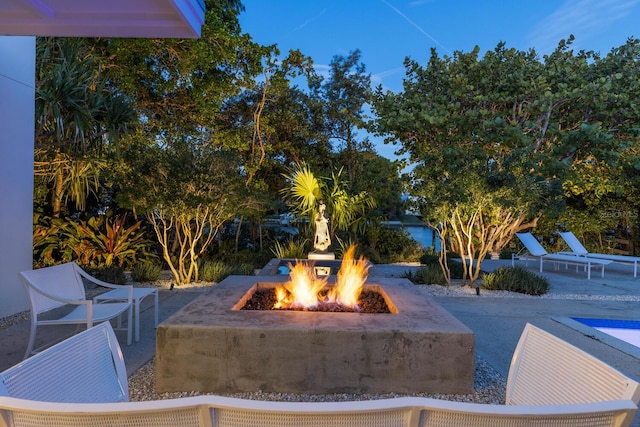 view of patio featuring an outdoor fire pit