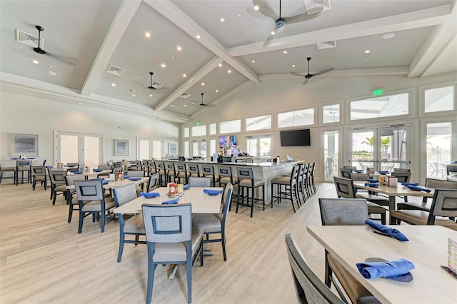 dining area with high vaulted ceiling, french doors, beamed ceiling, and visible vents