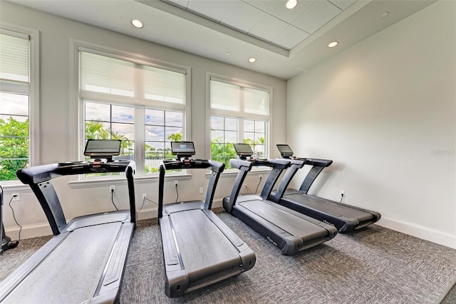 exercise room featuring a wealth of natural light, carpet flooring, and recessed lighting