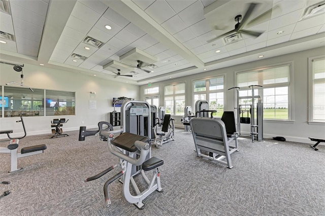 gym featuring carpet floors, visible vents, baseboards, and a ceiling fan