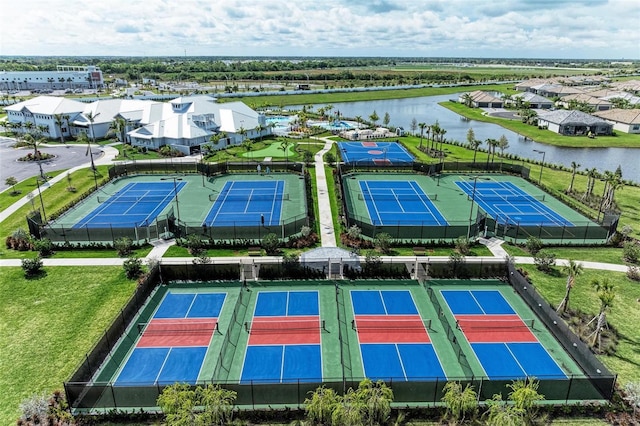 drone / aerial view featuring a water view and a residential view