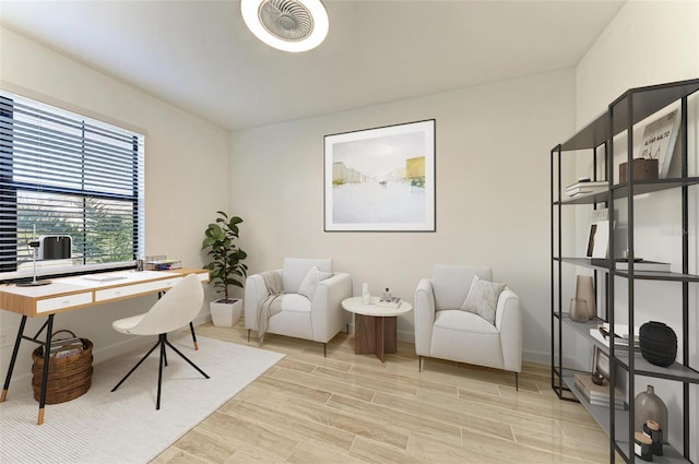 home office featuring wood tiled floor, visible vents, and baseboards