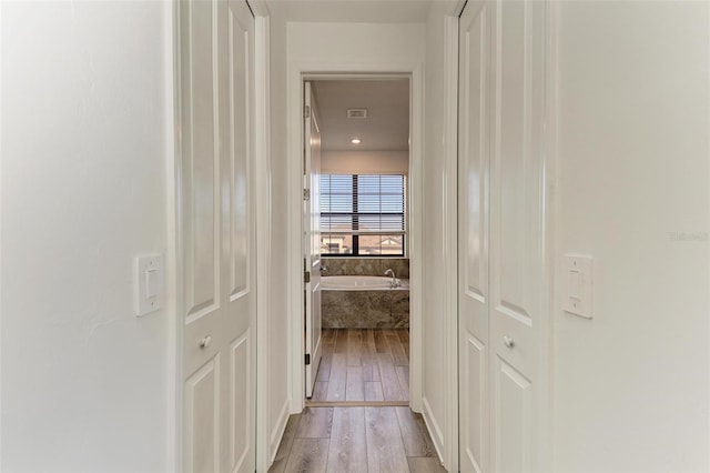 hall featuring light wood-style floors