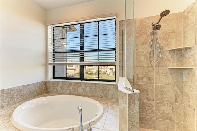 bathroom featuring a walk in shower and a bath