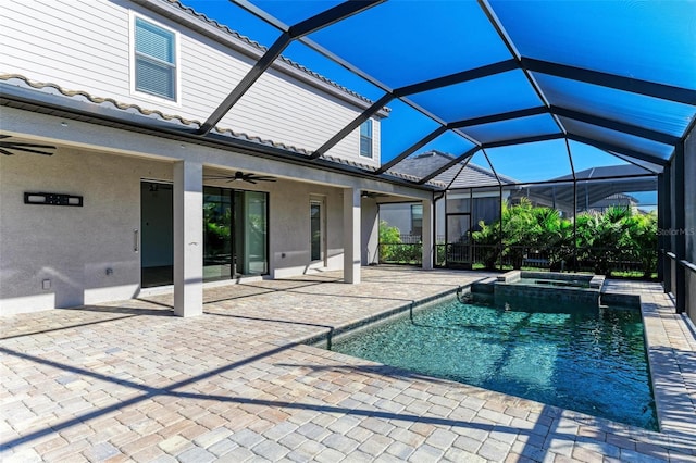 view of pool with a lanai, a patio area, ceiling fan, and a pool with connected hot tub