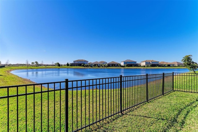 water view featuring a residential view and fence