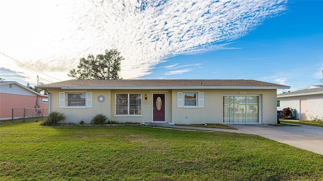 ranch-style home featuring a front yard