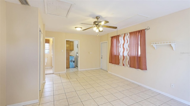 tiled spare room featuring ceiling fan