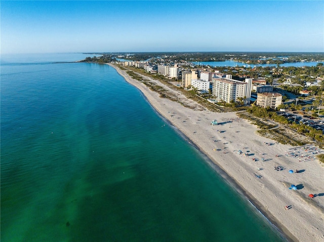 aerial view featuring a water view and a beach view