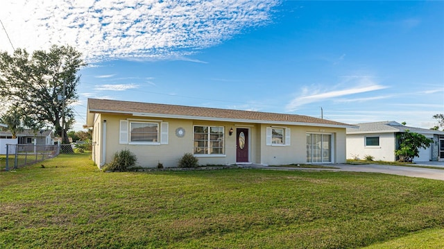 single story home featuring a front yard