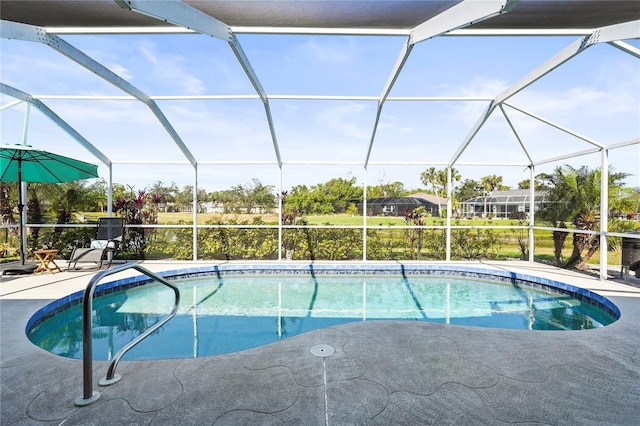 view of swimming pool with a patio and glass enclosure