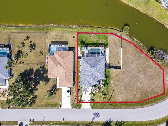 birds eye view of property featuring a water view