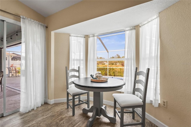 dining area featuring hardwood / wood-style floors