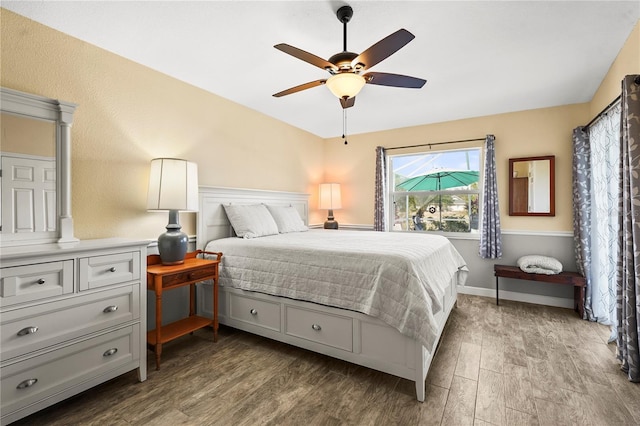 bedroom with hardwood / wood-style flooring and ceiling fan