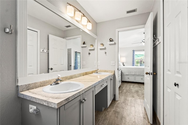 bathroom featuring ceiling fan, vanity, and hardwood / wood-style floors