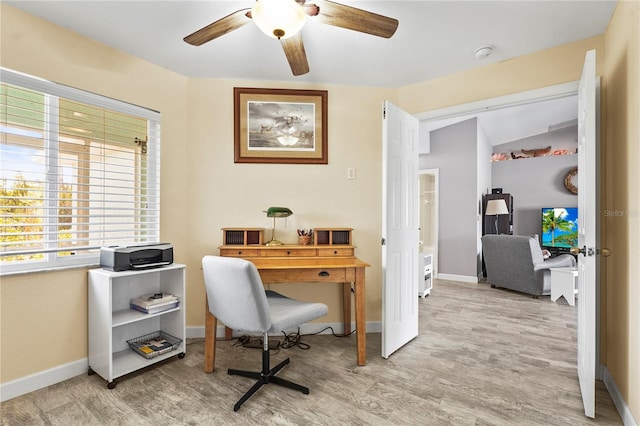 office with ceiling fan and light wood-type flooring