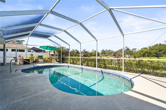 view of swimming pool featuring a lanai and a patio area