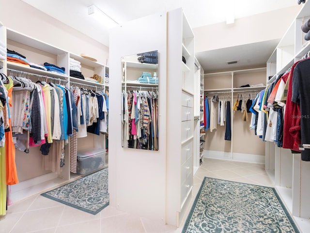 walk in closet featuring light tile patterned floors