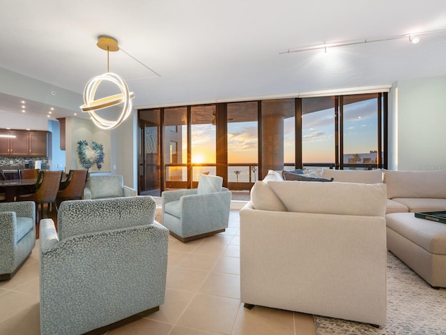 tiled living room featuring a wall of windows