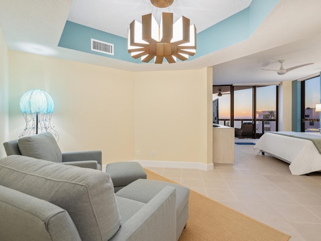 interior space featuring floor to ceiling windows and ceiling fan