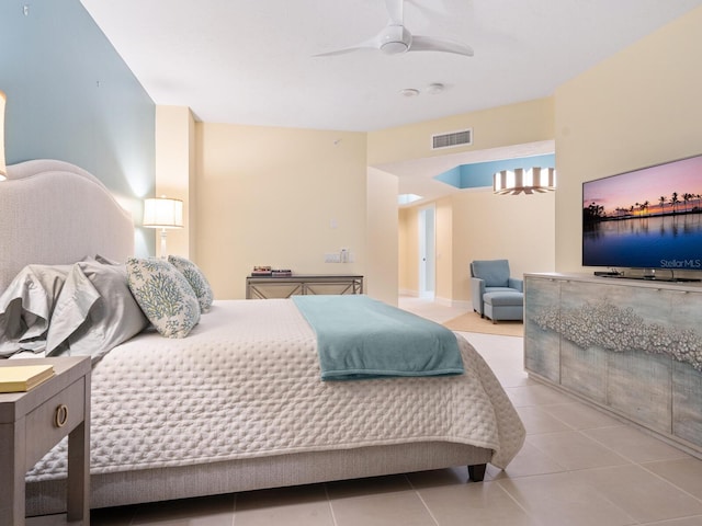 tiled bedroom featuring ceiling fan