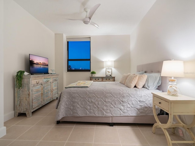 bedroom with ceiling fan and light tile patterned floors