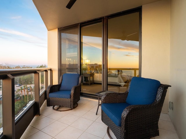 view of balcony at dusk