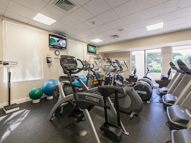 workout area with a paneled ceiling