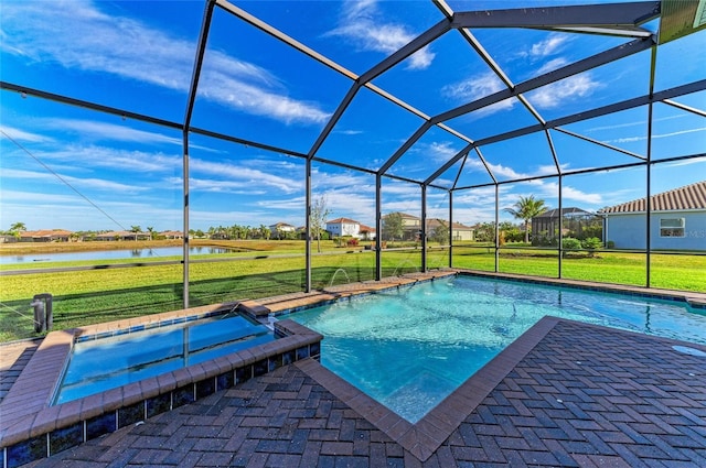 view of pool featuring a lawn, a water view, glass enclosure, pool water feature, and an in ground hot tub