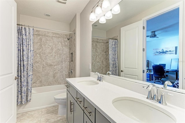 full bathroom featuring toilet, vanity, shower / bathtub combination with curtain, and a textured ceiling