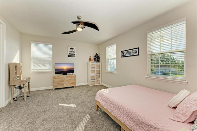 bedroom with light carpet and ceiling fan