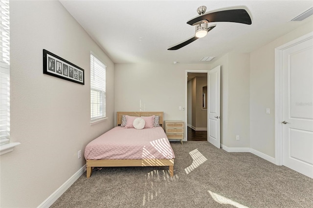 carpeted bedroom featuring ceiling fan