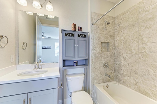 full bathroom with vanity, toilet, and tiled shower / bath