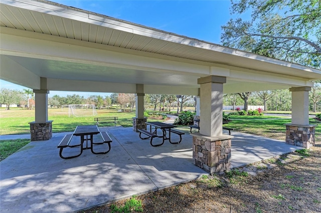 surrounding community with a gazebo and a yard