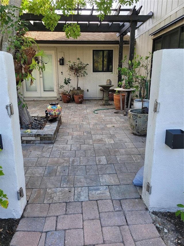 view of patio / terrace with a pergola and french doors