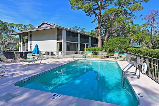 view of swimming pool with a patio area