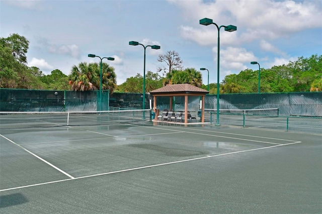 view of tennis court featuring a gazebo