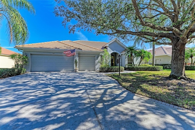 7215 Treymore Ct, Sarasota, FL 34243 - ranch-style house featuring a garage