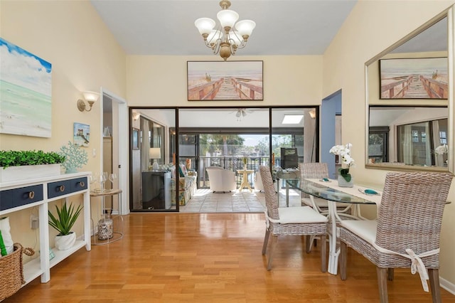 dining room featuring hardwood / wood-style floors and a notable chandelier