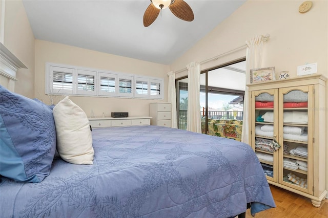 bedroom featuring lofted ceiling, access to outside, light hardwood / wood-style floors, and ceiling fan