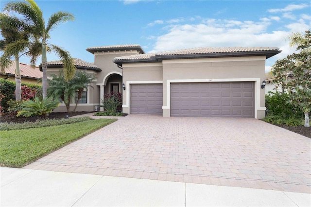 mediterranean / spanish house featuring a garage